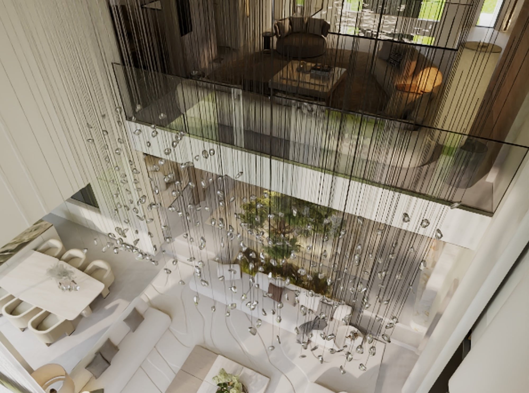 A double-height atrium seen from above, with a cascading crystal chandelier falling past a glazed mezzanine to a tree below, designed by Radwa Interiors.