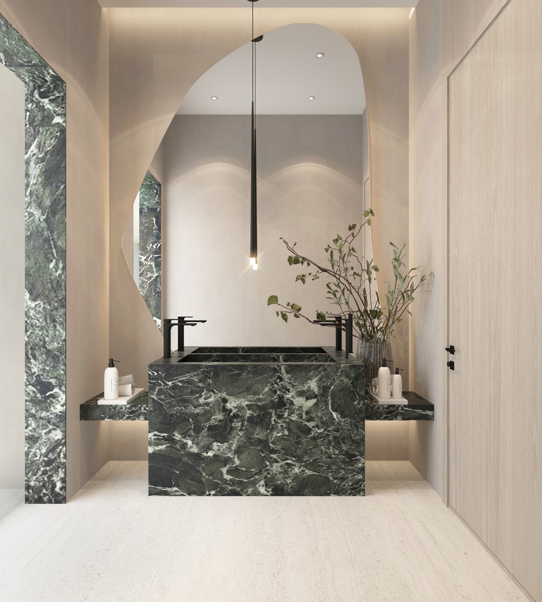 A washroom with a dark green marble basin block under an organic-edged mirror, flanked by matching stone shelves, designed by Radwa Interiors.