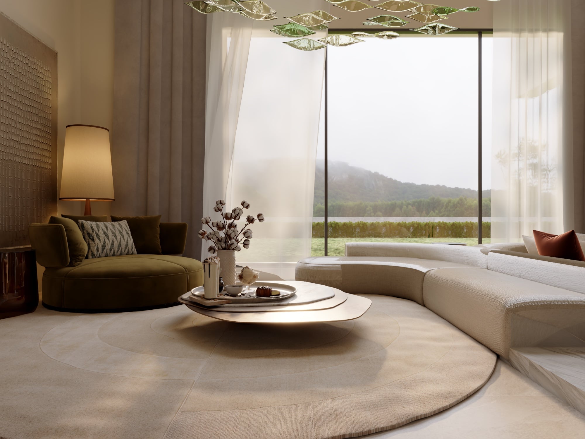 An olive velvet armchair beside a curved cream sofa and a layered stone table, looking out to hills through full-height glazing, designed by Radwa Interiors.