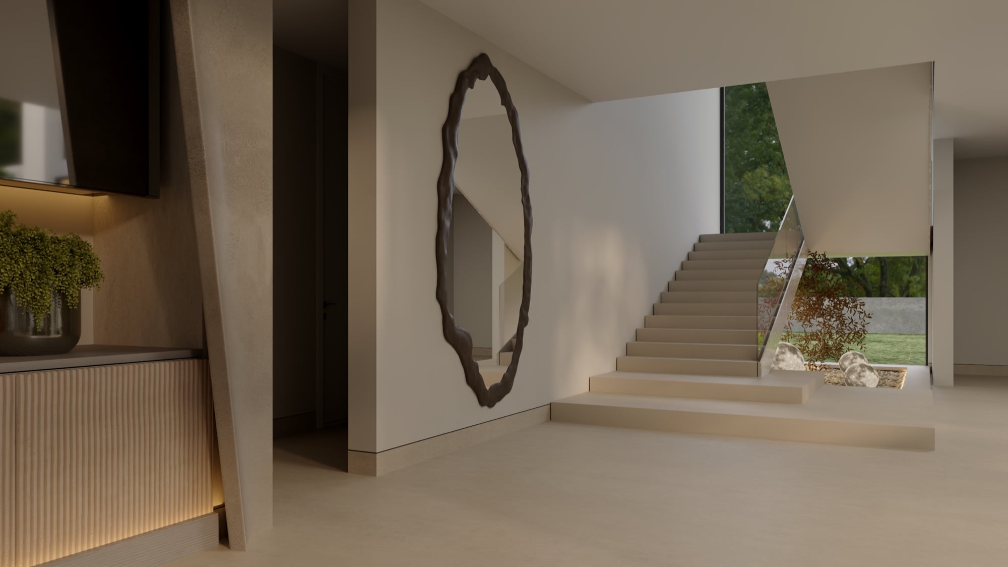 An entrance hall with a large organic-edged mirror, a ribbed console and a stone staircase beyond, designed by Radwa Interiors.
