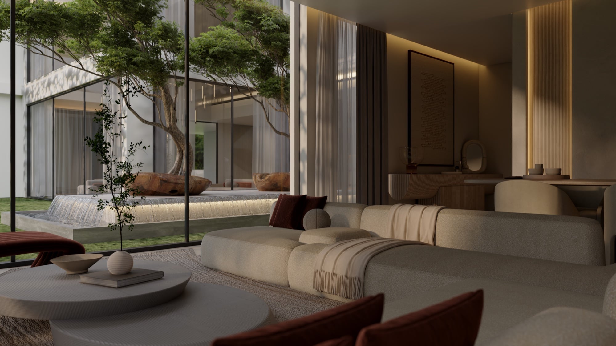 A living room open to a courtyard with a tree and water feature, with rust cushions and a framed artwork, designed by Radwa Interiors.