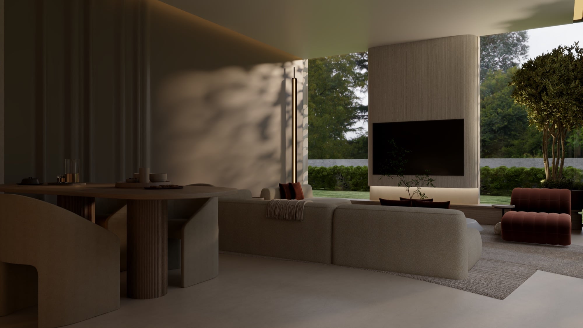 A living room with a screen on a timber chimney breast, a rust ottoman and a dining table, open to the lawn, designed by Radwa Interiors.