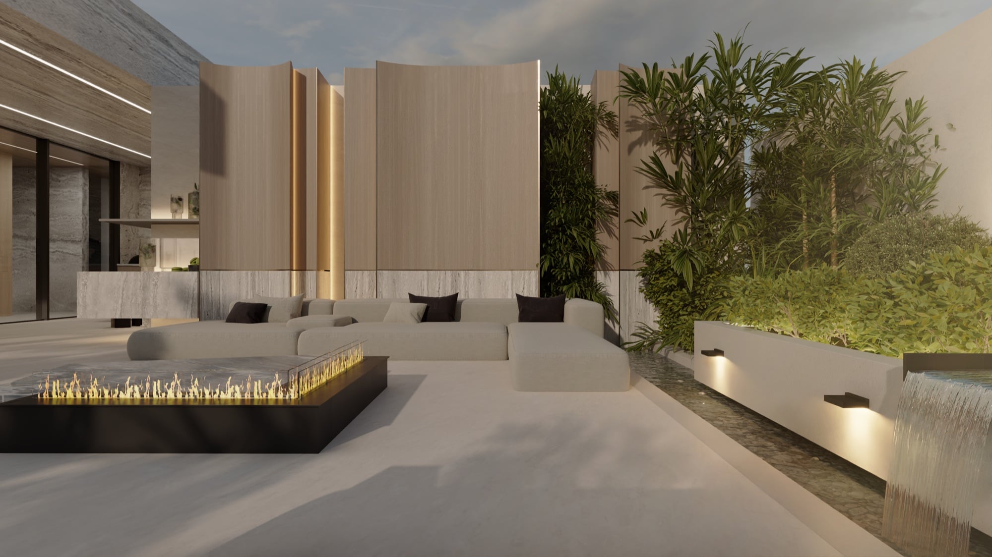 A terrace with a linear fire table and low seating, backed by timber fins and a planted water wall, designed by Radwa Interiors.