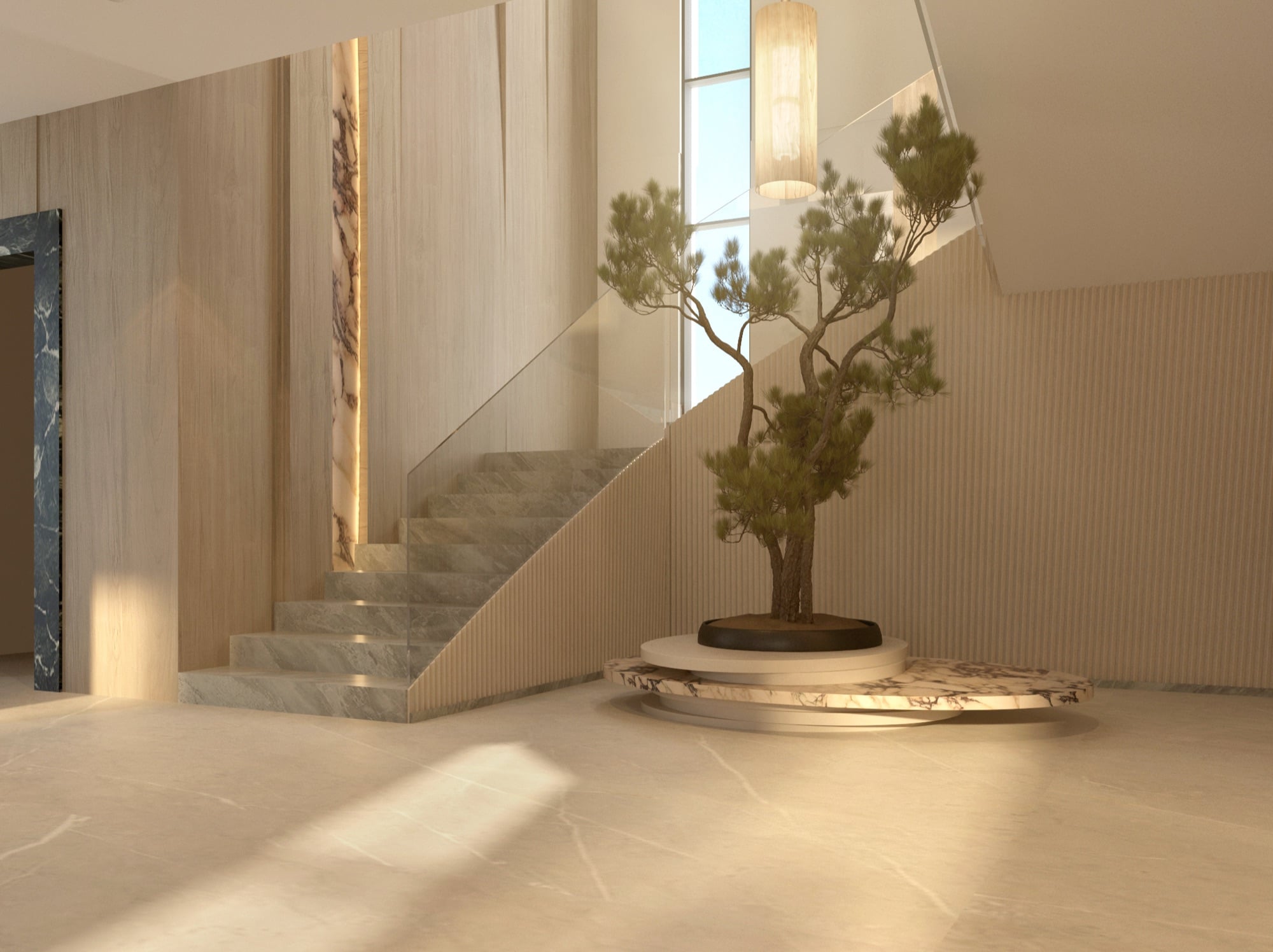 A pine on a stepped marble plinth beside a stone staircase, with a veined stone panel and ribbed wall behind, designed by Radwa Interiors.