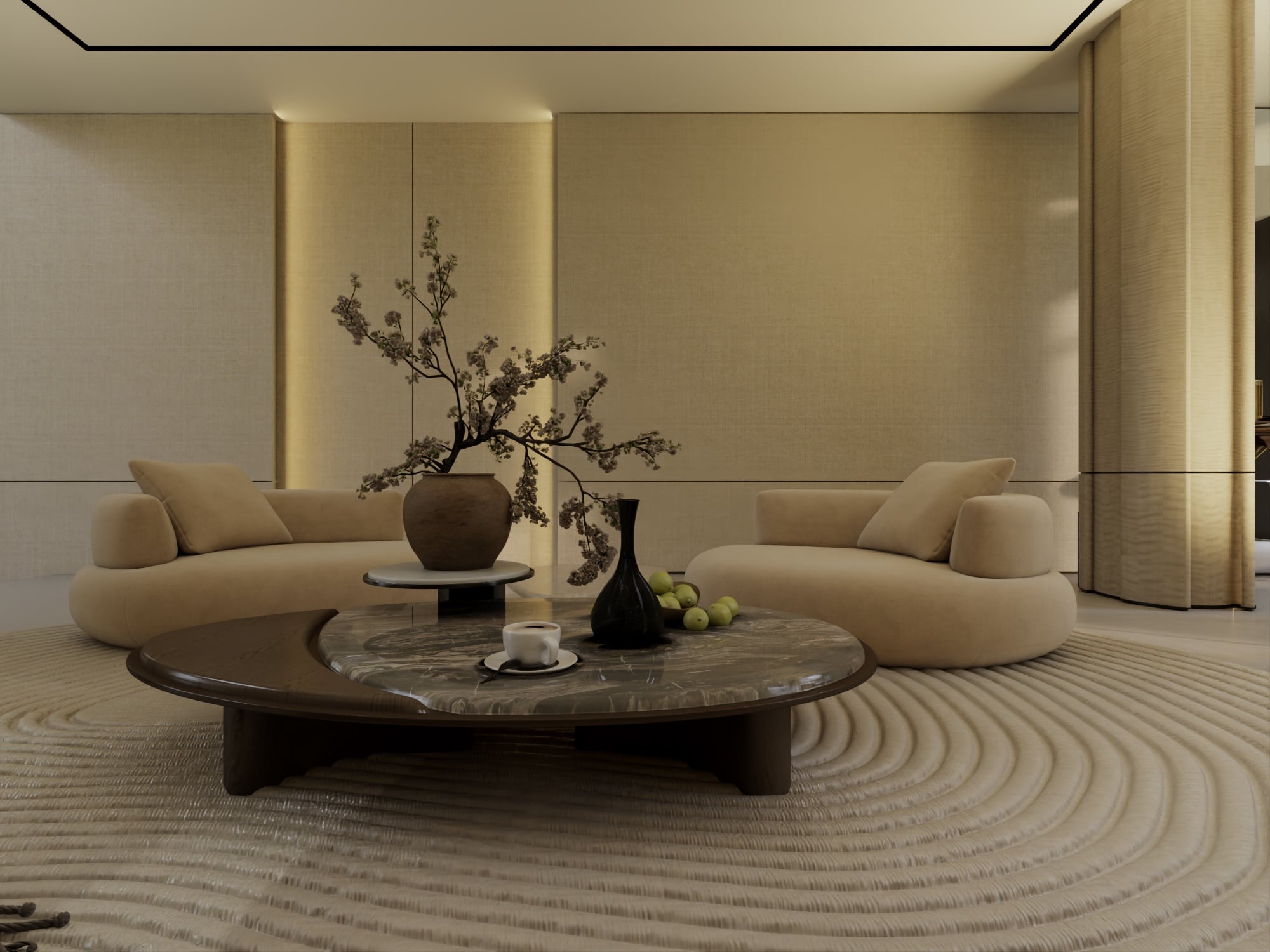 Two curved cream sofas facing a low round marble table, with a blossom branch in a ceramic urn on a raked sand-pattern rug, designed by Radwa Interiors.